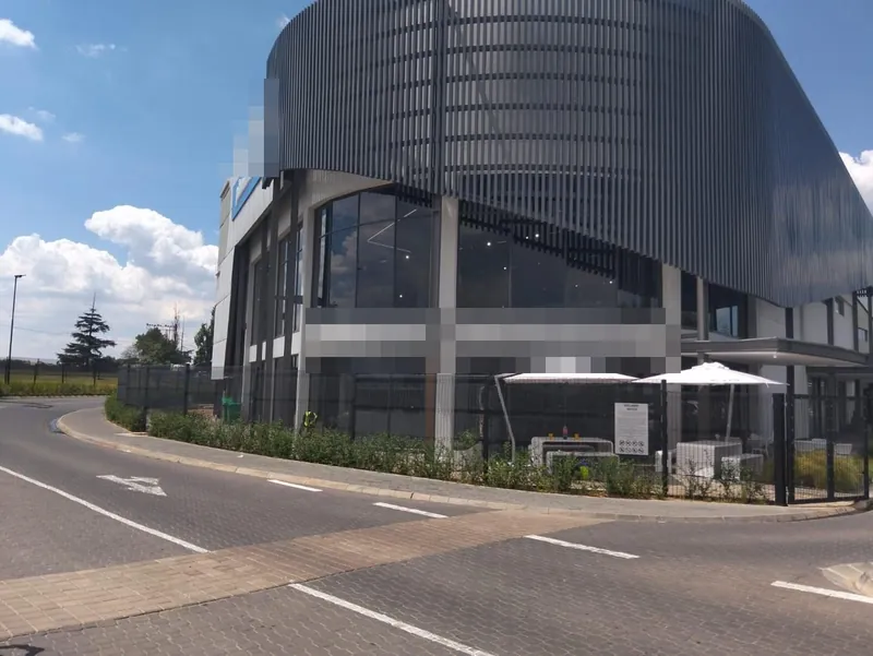 Cafe front in Johannesburg with Sola-X charcoal window tint.